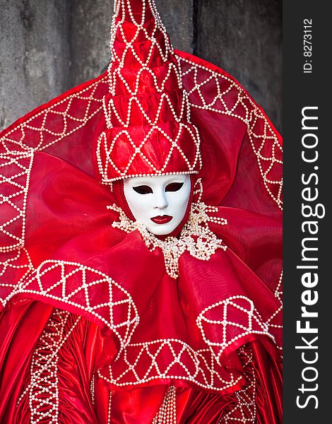 Red costume with white pearls at the Venice Carnival. Red costume with white pearls at the Venice Carnival