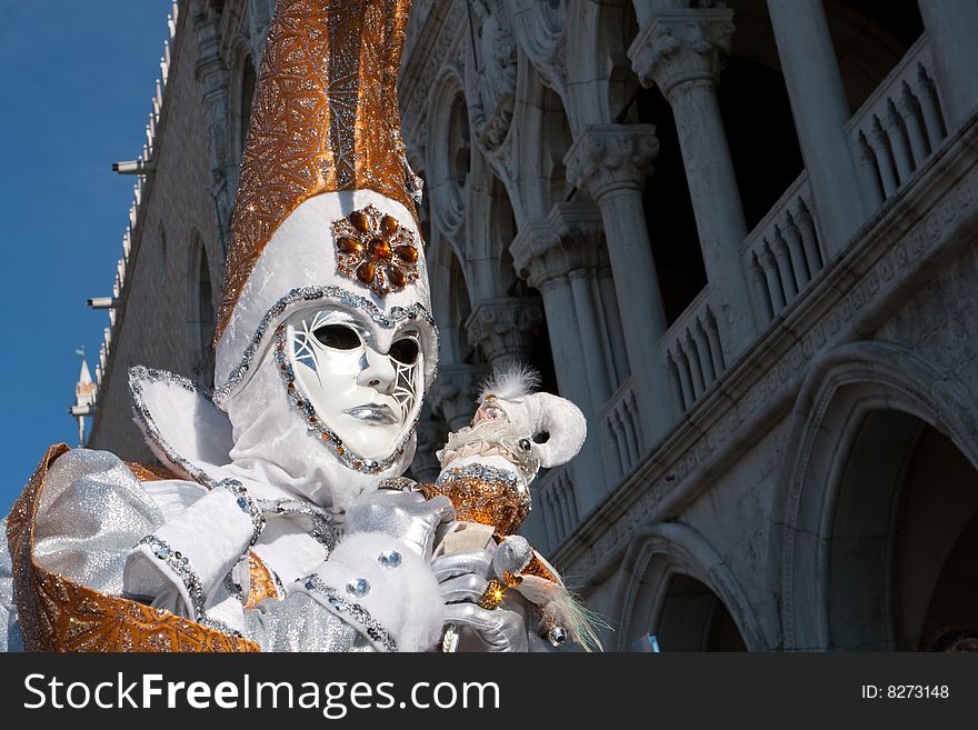 White and gold costume at the Venice Carnival. White and gold costume at the Venice Carnival