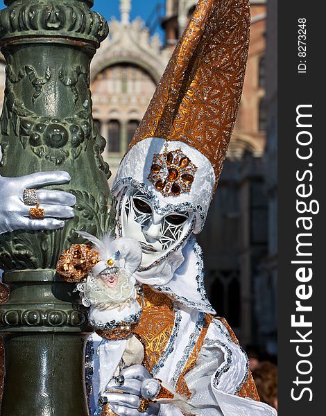 White and gold costume at the Venice Carnival. White and gold costume at the Venice Carnival