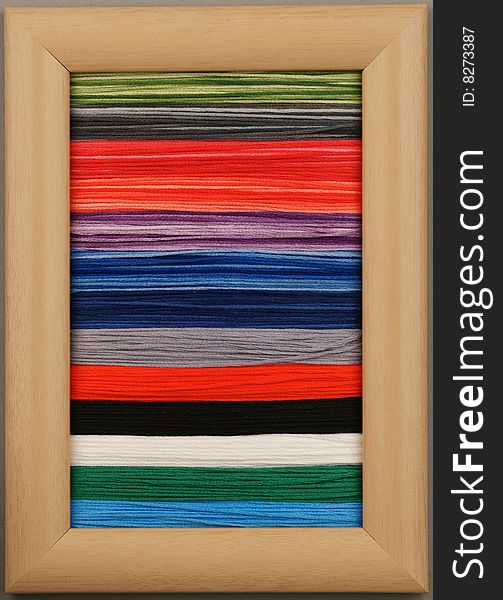 Colored wool thread background on a frame. Colored wool thread background on a frame
