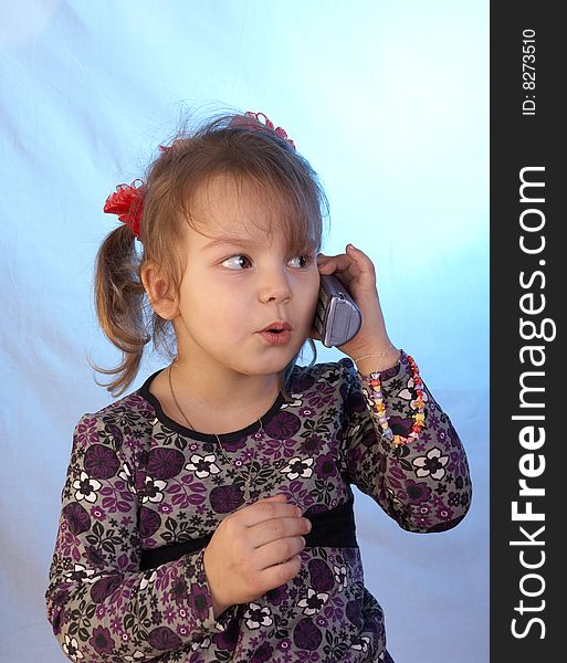 Young girl talking via phone. Young girl talking via phone