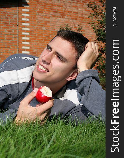 Young man in green grass