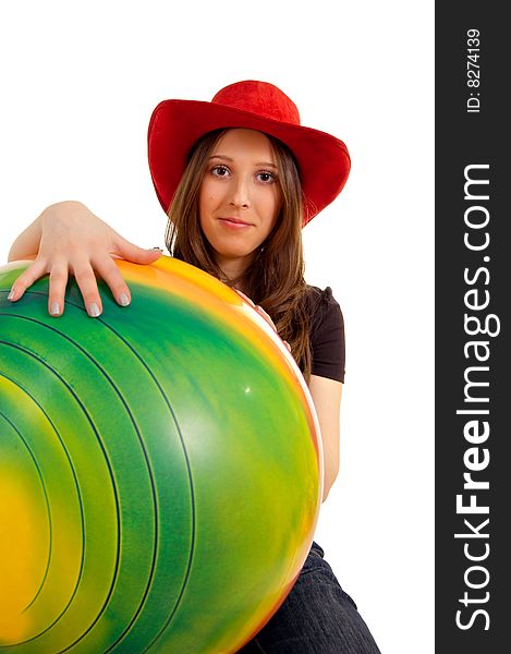 Girl in a western hat with a large ball. Girl in a western hat with a large ball