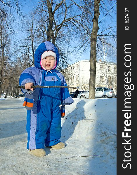 Kid playing in the park in winter