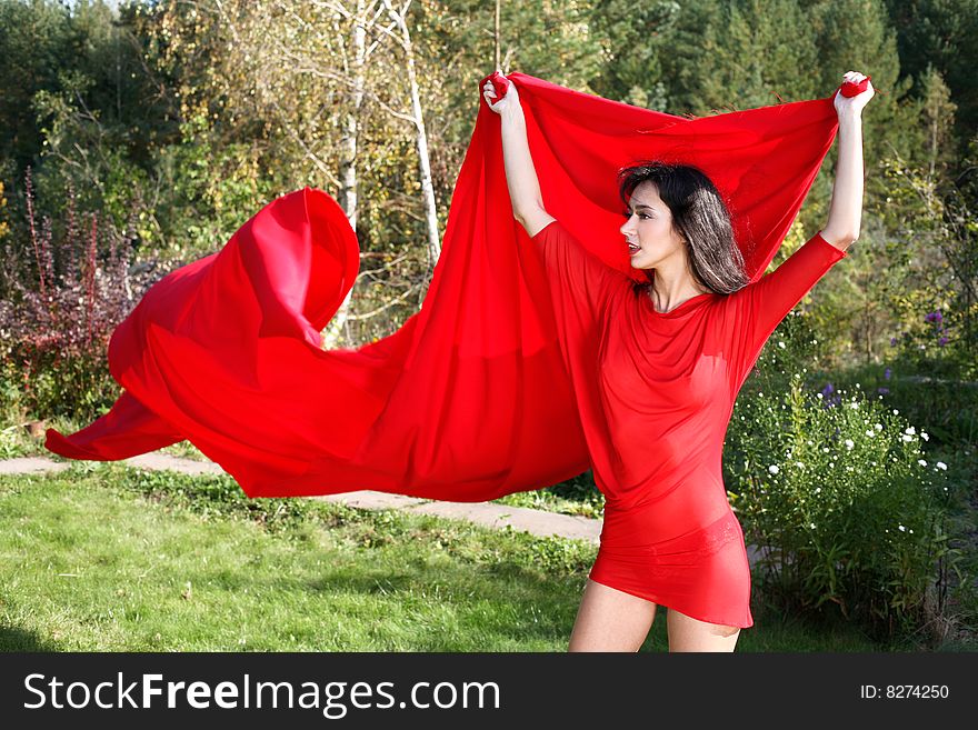 Lovely girl red dress and flapping. Lovely girl red dress and flapping