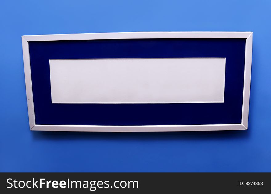 Rectangular picture frame on a blue background. Rectangular picture frame on a blue background