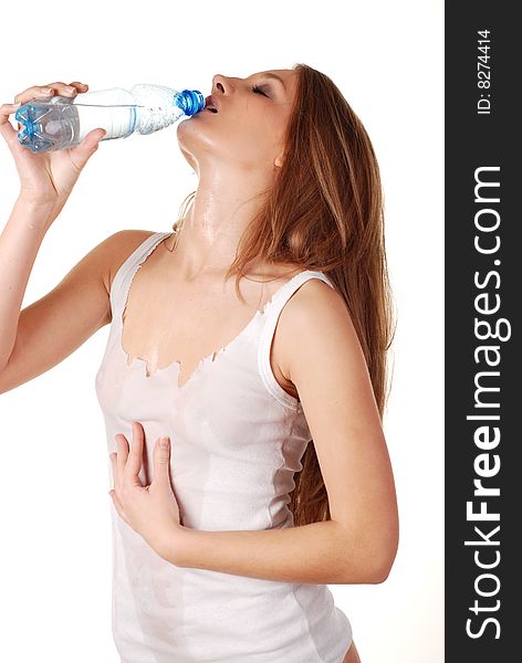 Woman in wet white shirt with bottle of water. Woman in wet white shirt with bottle of water