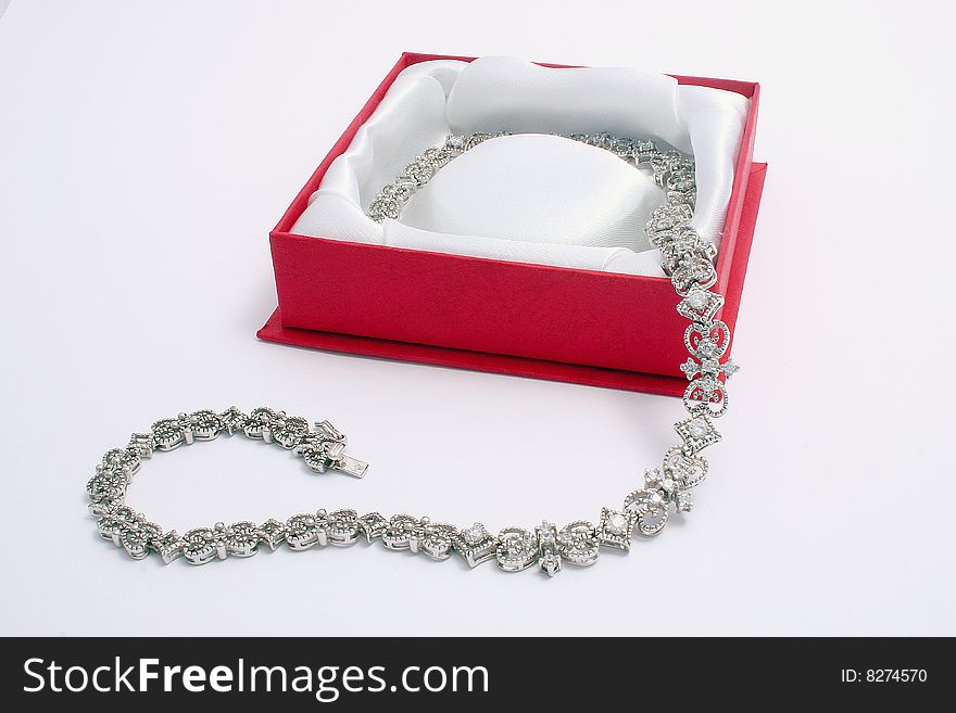 White gold necklace in a red box