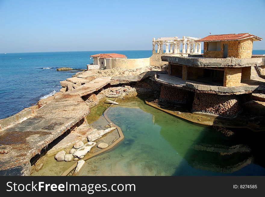 Damaged and drown house on the sea coast