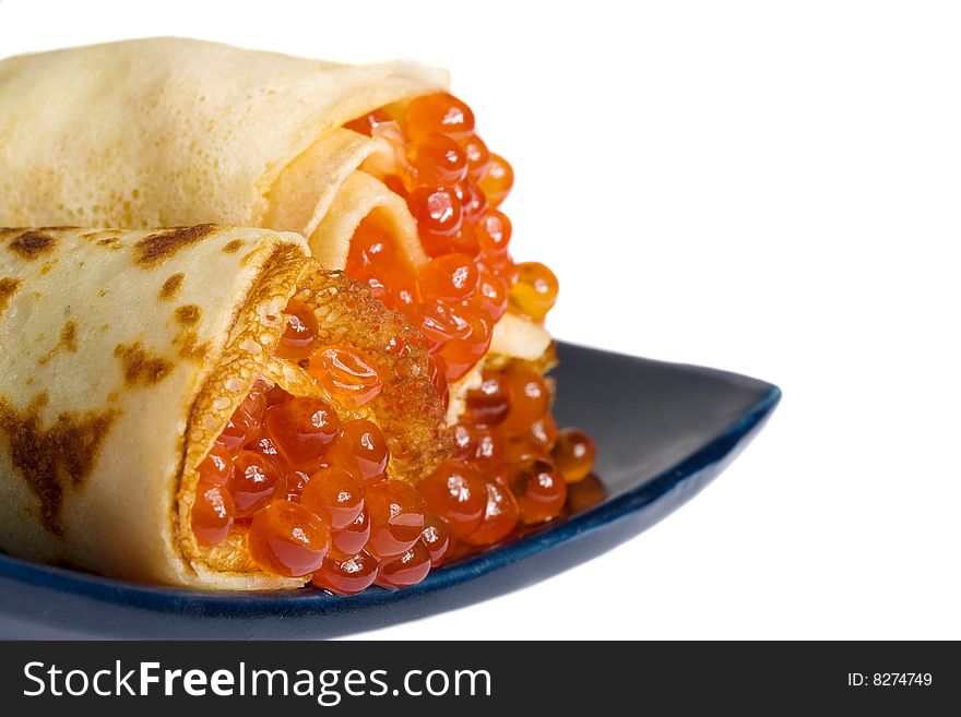 Pancakes with red caviar isolated on white. Pancakes with red caviar isolated on white