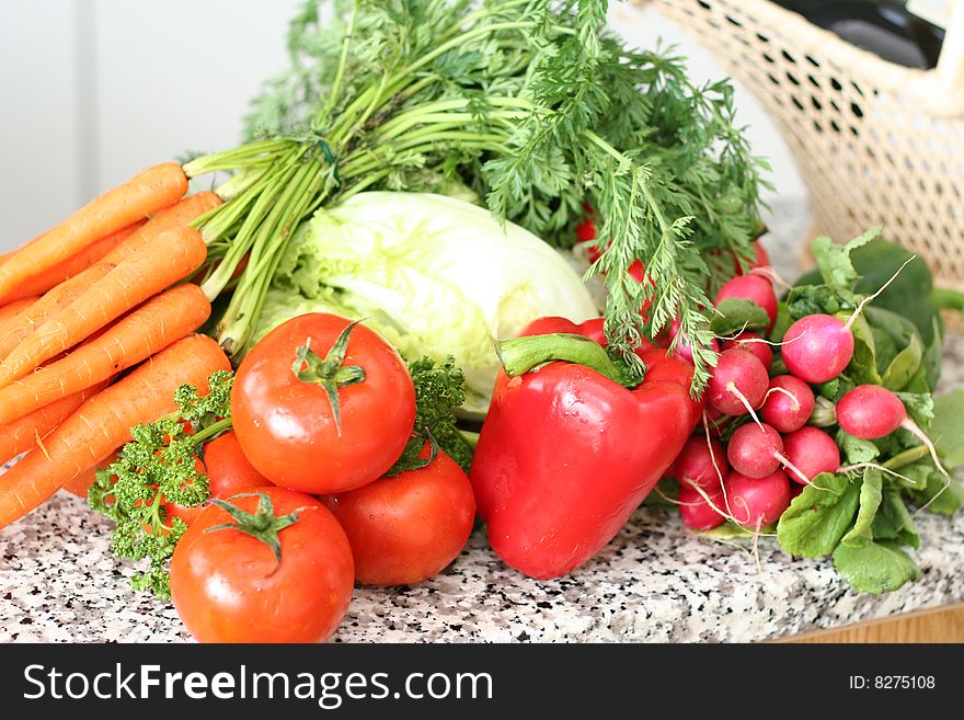 Different vegetables on table in the kitchen. Different vegetables on table in the kitchen