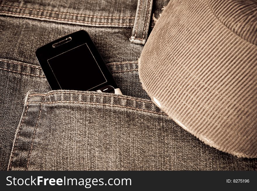Grunge Jeans With A Mobile Phone And Baseball Cap
