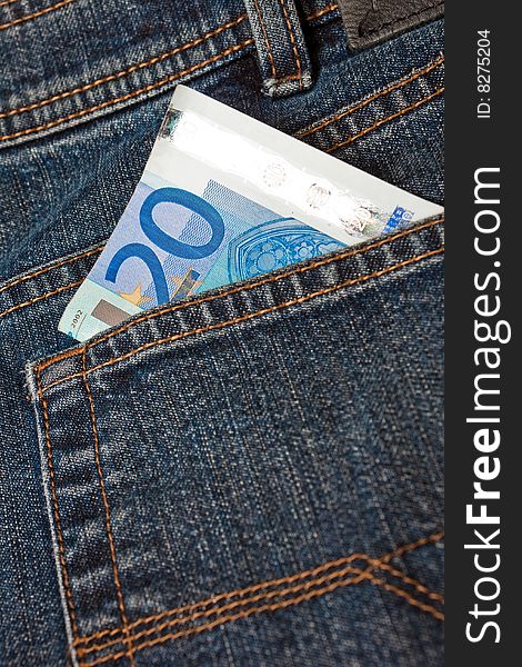 Blue denim jeans with a twenty euro note in the pocket