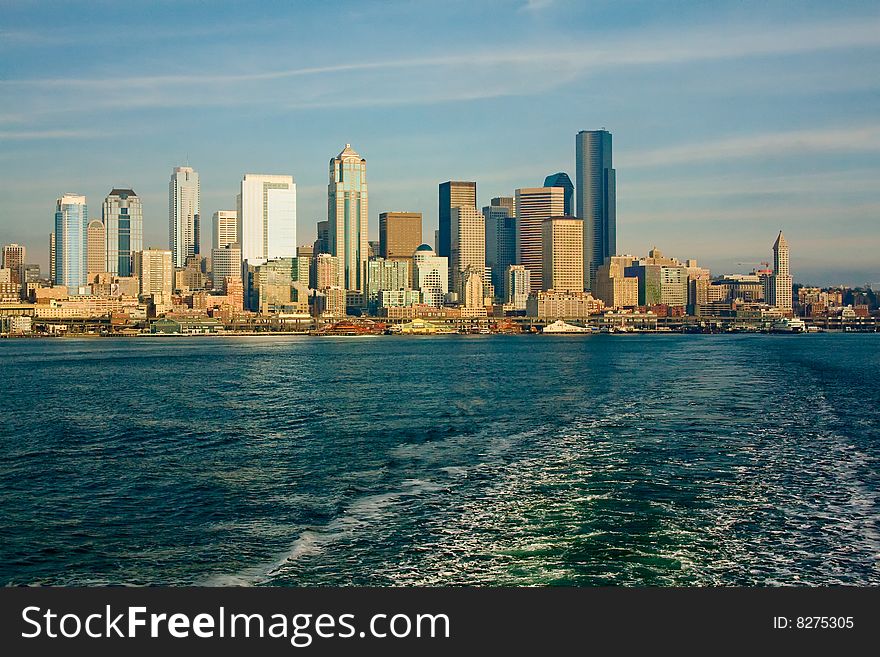 The Seattle, Washington skyline from a ferry boat in the Puget Sound, on a bright, sunny day. The Seattle, Washington skyline from a ferry boat in the Puget Sound, on a bright, sunny day.