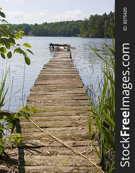 A wooden pier on a lake. A wooden pier on a lake