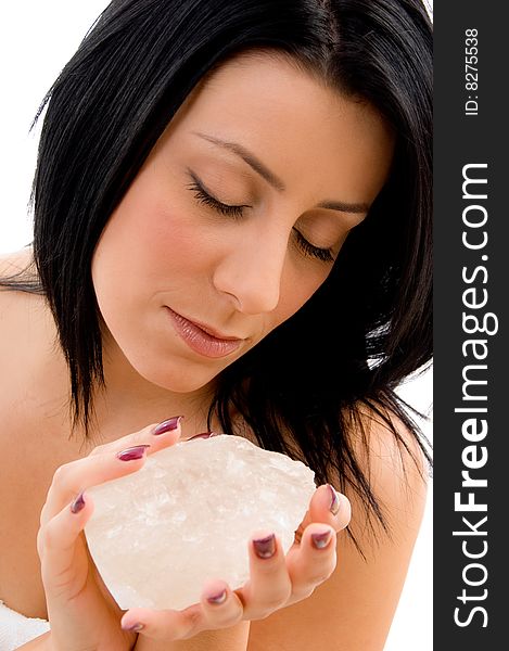 Top view of smiling young woman scrubbing her body against white background. Top view of smiling young woman scrubbing her body against white background