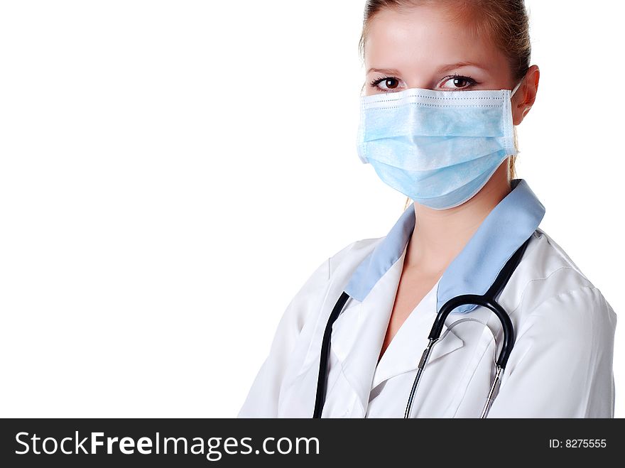 Beautiful nurse with stethoscope and mask on white background