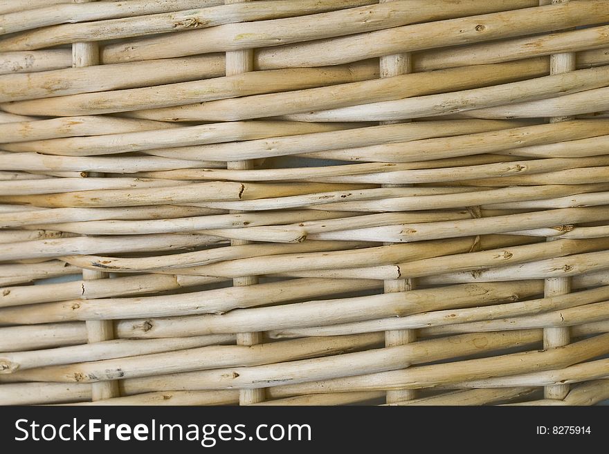 Close up background of tan colored wooden wicker basket. Close up background of tan colored wooden wicker basket.