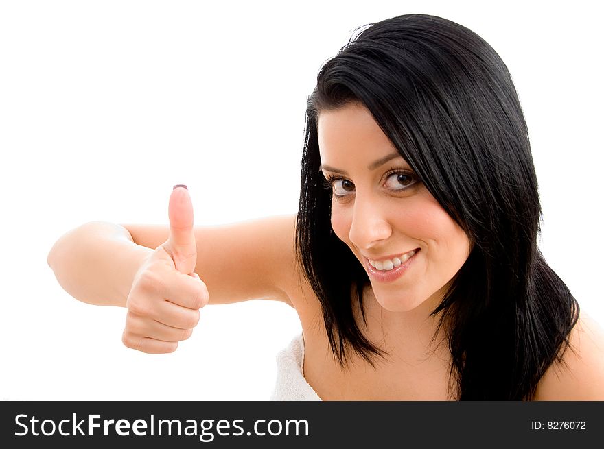 Top view of smiling woman showing thumb up on an isolated background