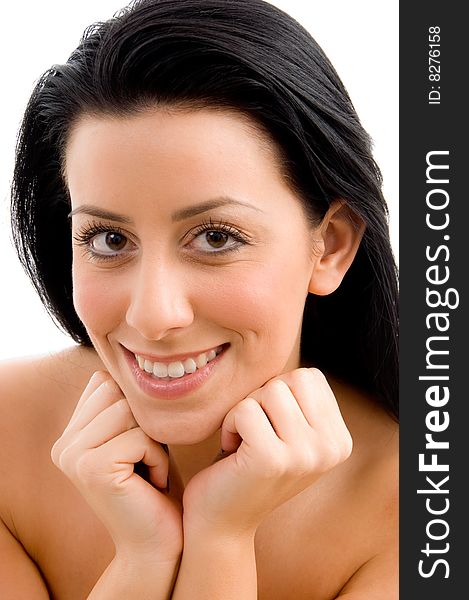 Close up of smiling young woman looking at camera with white background. Close up of smiling young woman looking at camera with white background