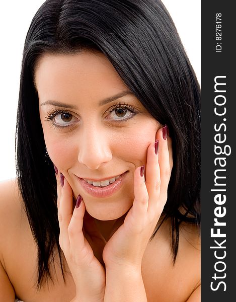 Close up of smiling young female looking at camera against white background. Close up of smiling young female looking at camera against white background