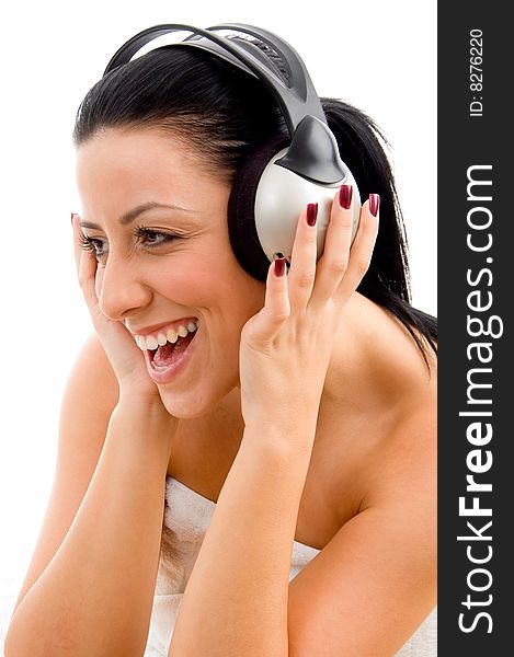 Front view of smiling woman enjoying music on an isolated white background. Front view of smiling woman enjoying music on an isolated white background