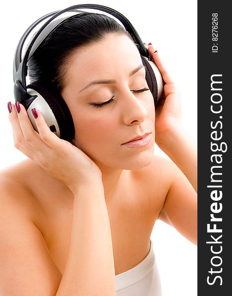 Top view of young female enjoying music with white background. Top view of young female enjoying music with white background