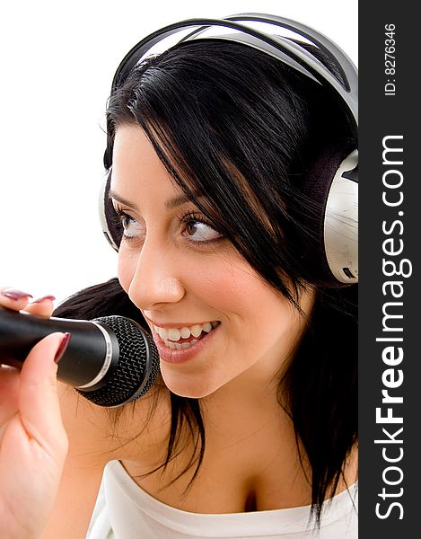 Top view of young woman with headphone and microphone on white background