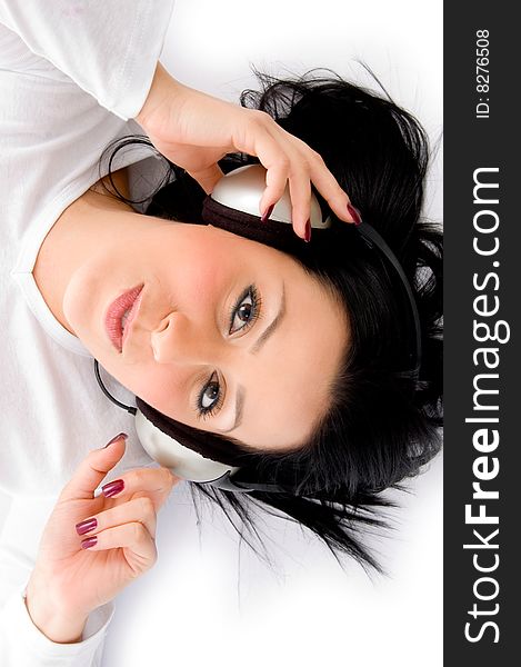 Top view of female listening music on an isolated white background. Top view of female listening music on an isolated white background