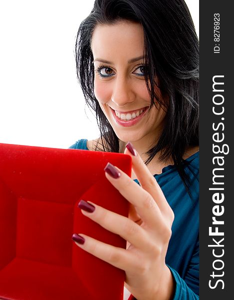 Close view of pleased woman holding case on an isolated white background. Close view of pleased woman holding case on an isolated white background