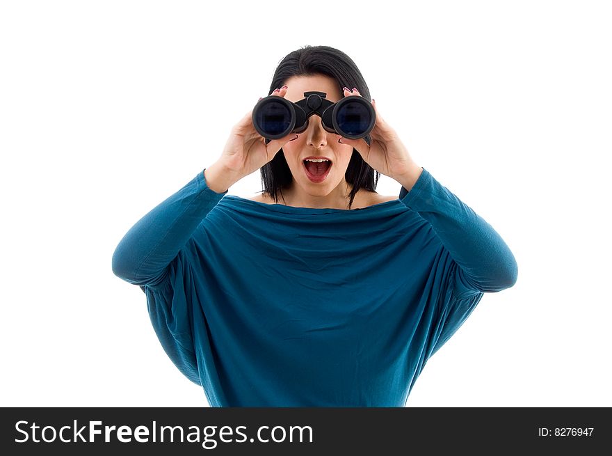 Portrait of female looking through binocular against white background