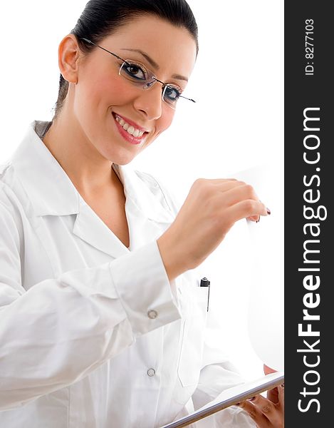 Side pose of smiling doctor looking at camera on an isolated white background. Side pose of smiling doctor looking at camera on an isolated white background