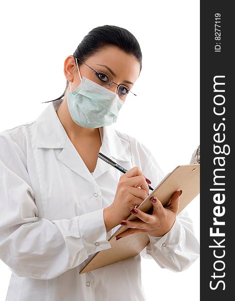 Doctor with writing pad and mask on white