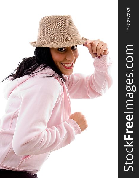 Side pose of smiling model holding hat on an isolated white background. Side pose of smiling model holding hat on an isolated white background
