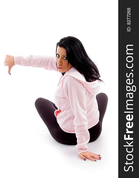 Back pose of model with thumbs down on an isolated white background