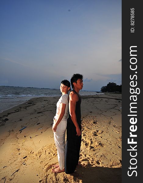 Couple Strolling On The Beach. Couple Strolling On The Beach