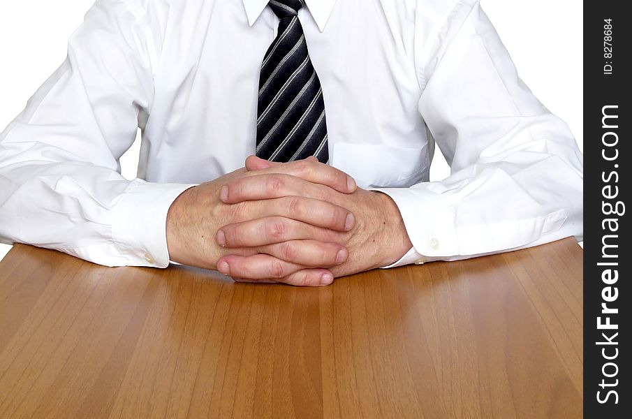 Business man sitting on the table isolated