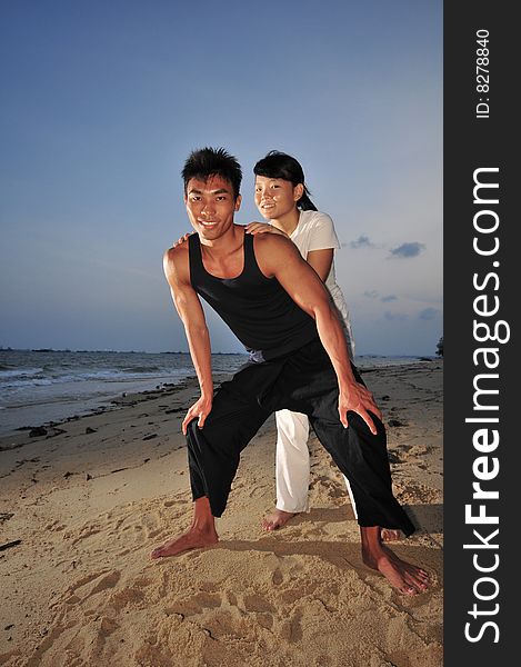 Couple Strolling On The Beach. Couple Strolling On The Beach