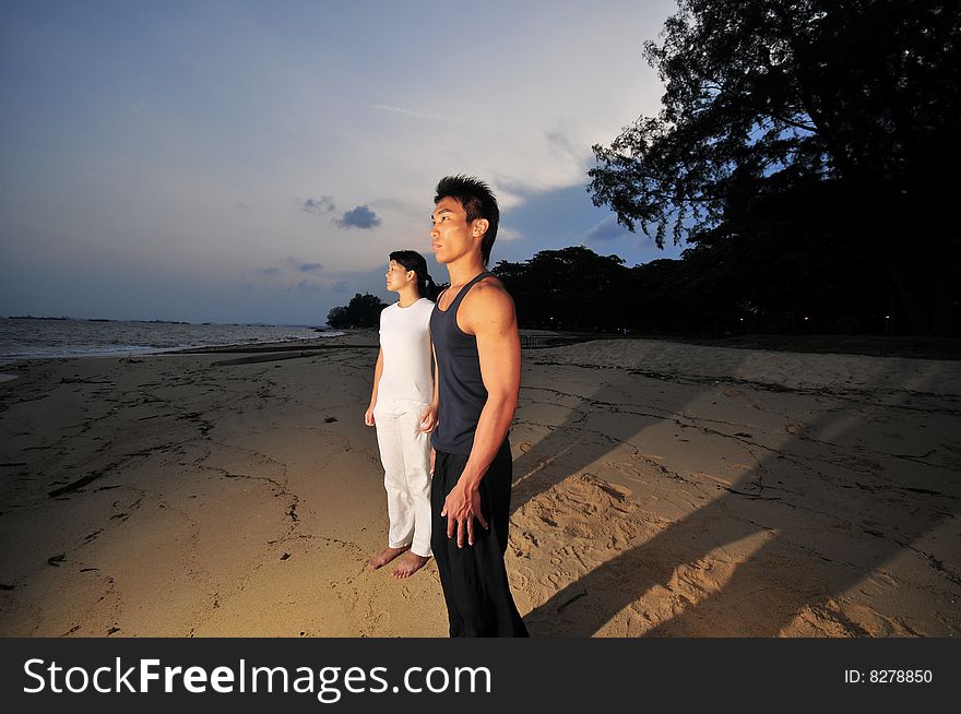 Couple Strolling On The Beach. Couple Strolling On The Beach