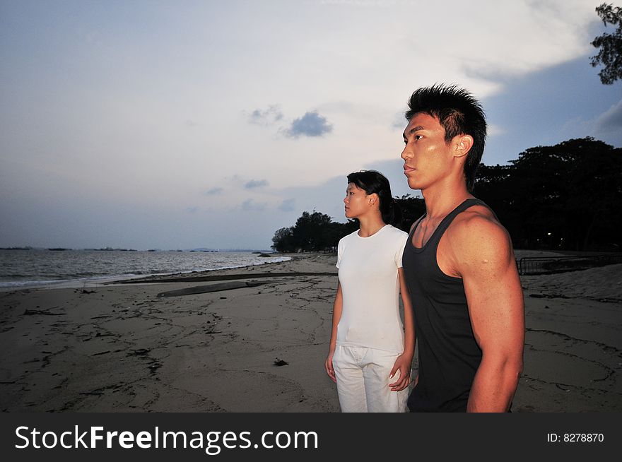 Couple Strolling On The Beach. Couple Strolling On The Beach