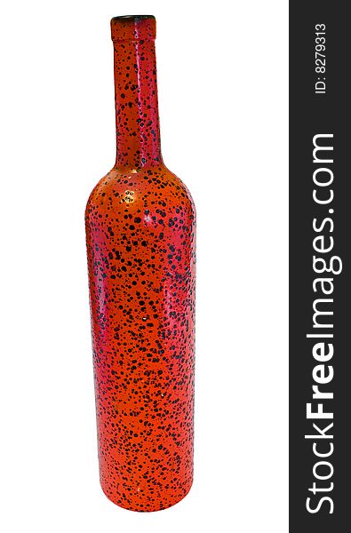 The red glass bottle with black specks on a white background. The red glass bottle with black specks on a white background