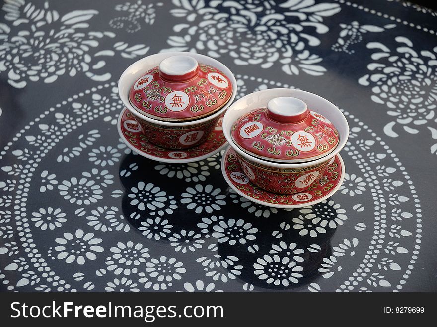 Two tea cups on a traditional table