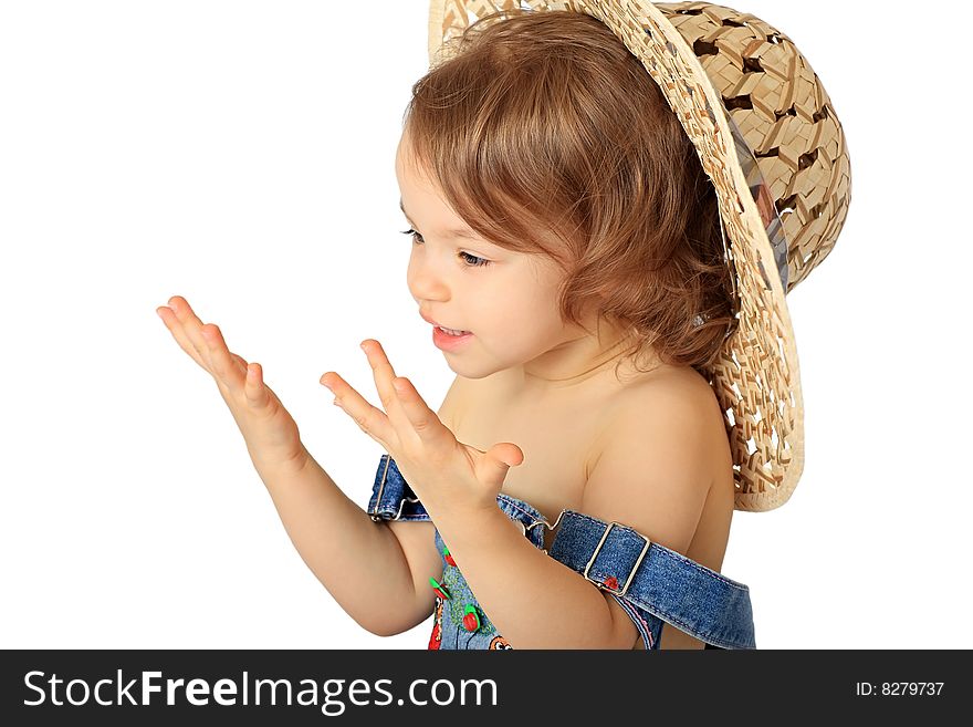 A little girl is in a straw hat. A little girl is in a straw hat.