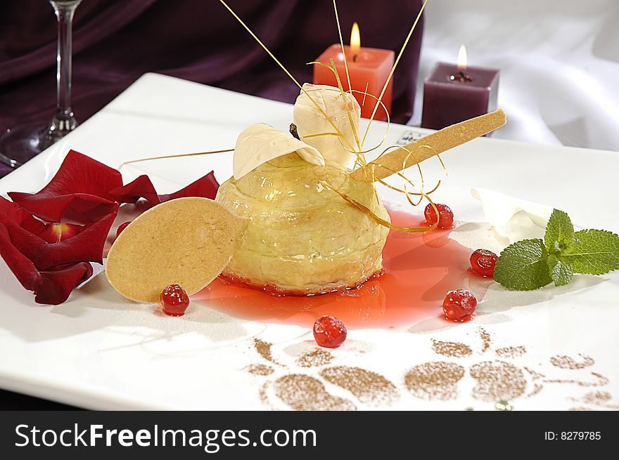 Waffle dessert with caramel, decorated with rose petals and mint