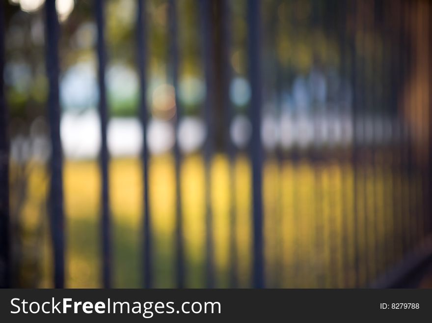 Abstract image of a wrought iron fence in warm sunlight. Abstract image of a wrought iron fence in warm sunlight