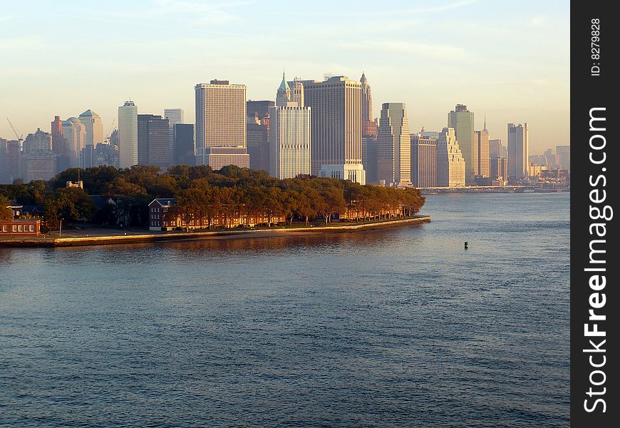 The first light of a crisp Fall morning shines on the skyline of Manhattan. The first light of a crisp Fall morning shines on the skyline of Manhattan