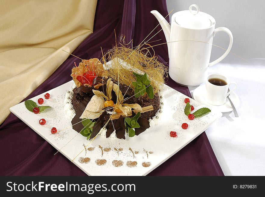 Luxorious chocolate cake and cup of coffee