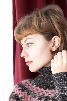 Young Beautiful Woman Looking Into Window Royalty Free Stock Images