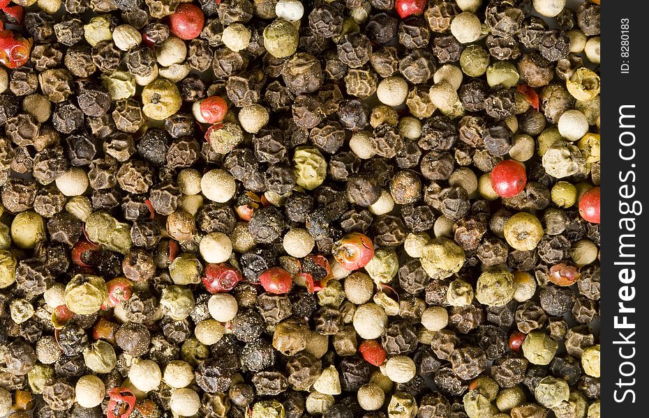 A close-up of a lot of different colour pepper. A close-up of a lot of different colour pepper