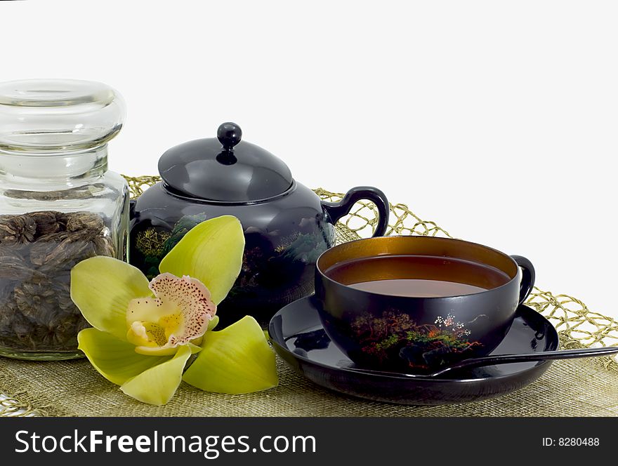 Green tea in a bright cup on a white background. Green tea in a bright cup on a white background